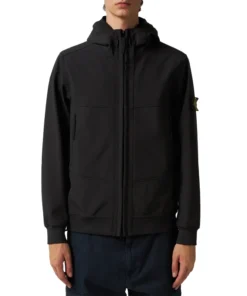The Stone Island Light Soft Shell Black Jacket is made from durable polyester, featuring a hooded collar and ribbed knit cuffs for a comfortable and secure fit. With a front zip closure and sleek black design, this lightweight jacket is perfect for casual wear, outdoor activities, or layering in cooler weather, combining style and functionality effortlessly.